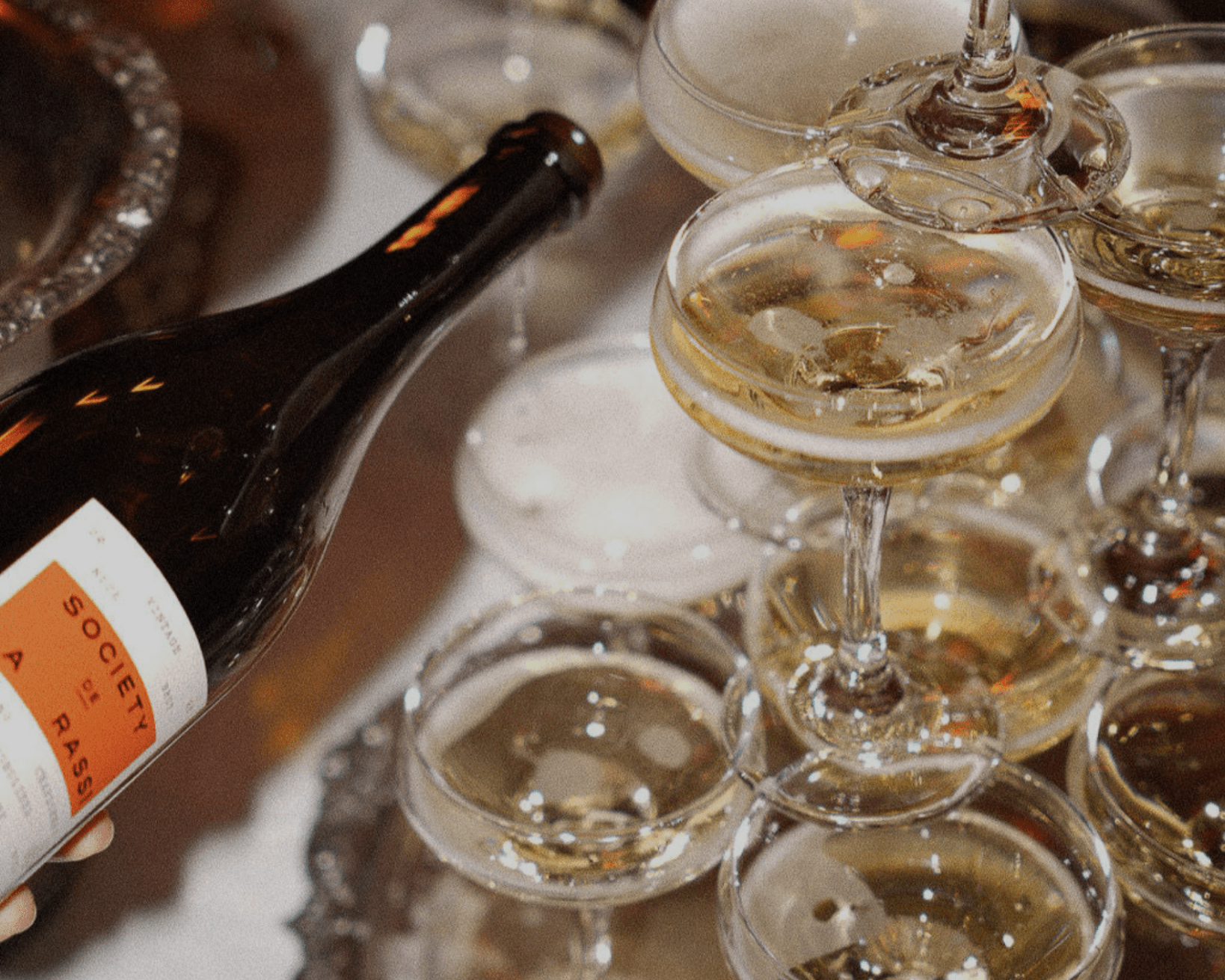 Society De La Rassi pouring a Non-Alcoholic champagne tower.