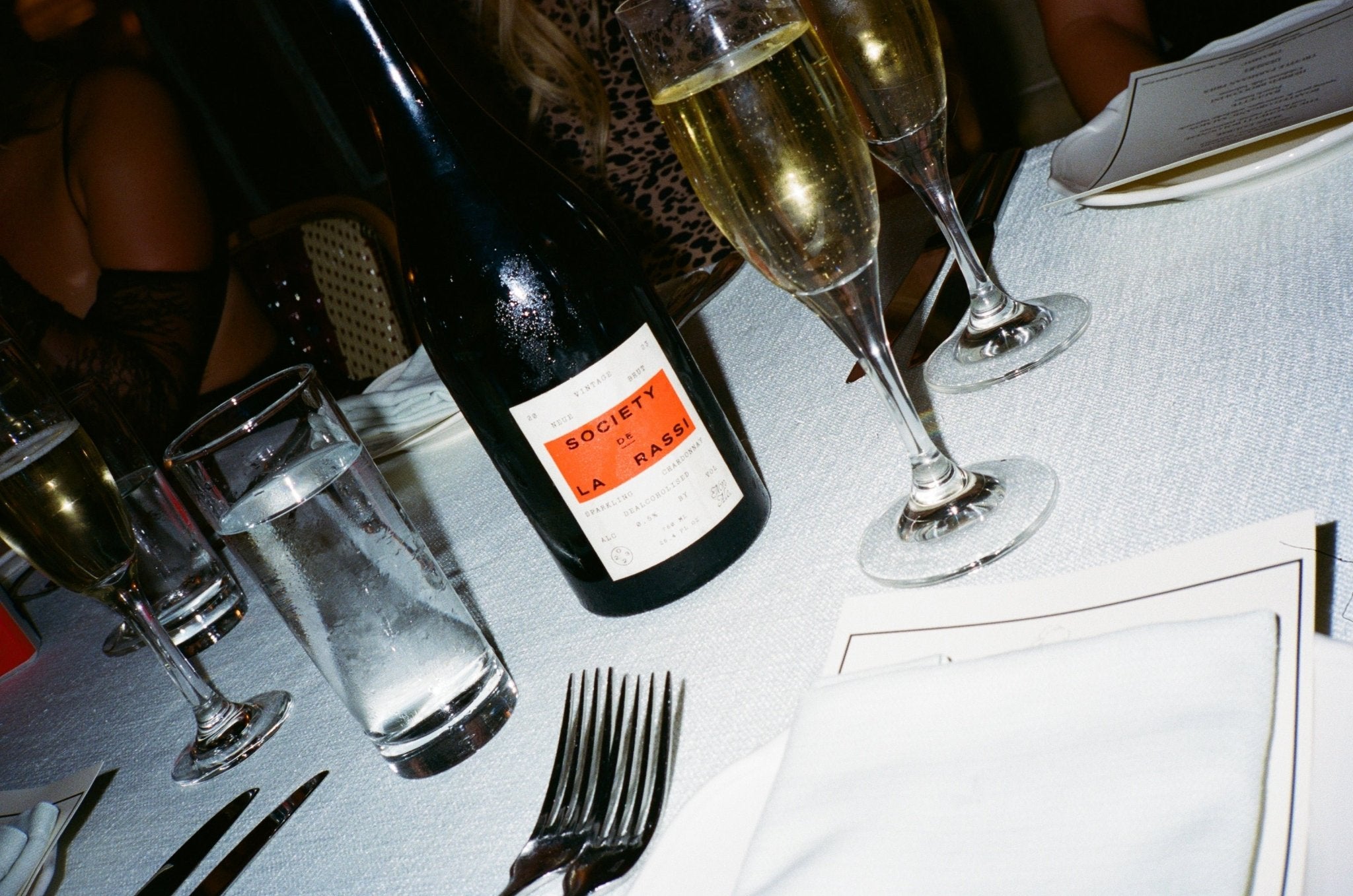 Society De La Rassi wine bottle on restaurant table