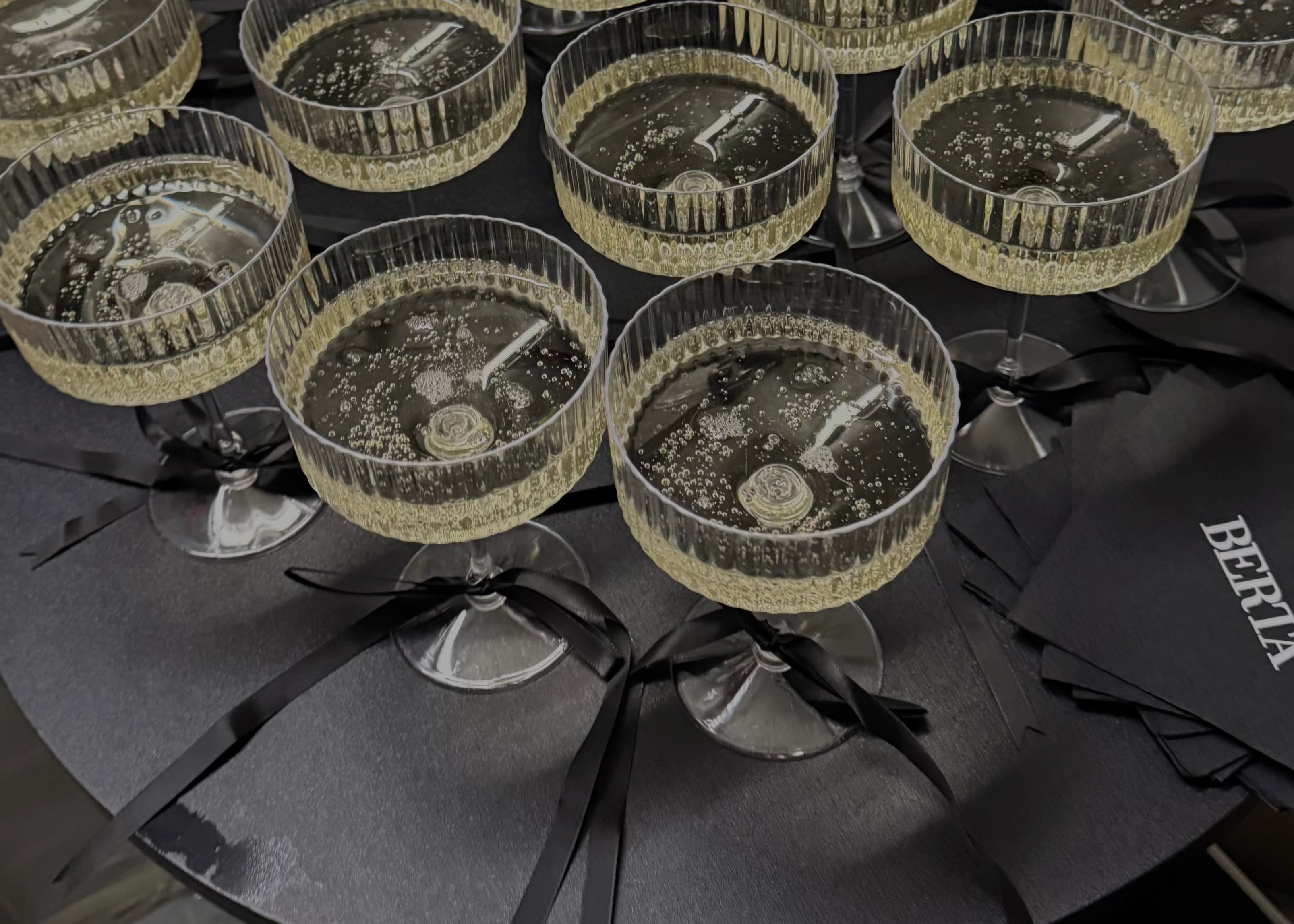 Cocktail glasses with a black napkin and 'Bering' brand name in the background